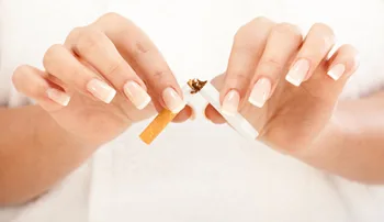 Hands breaking a cigarette, quit smoking acupuncture in Toronto